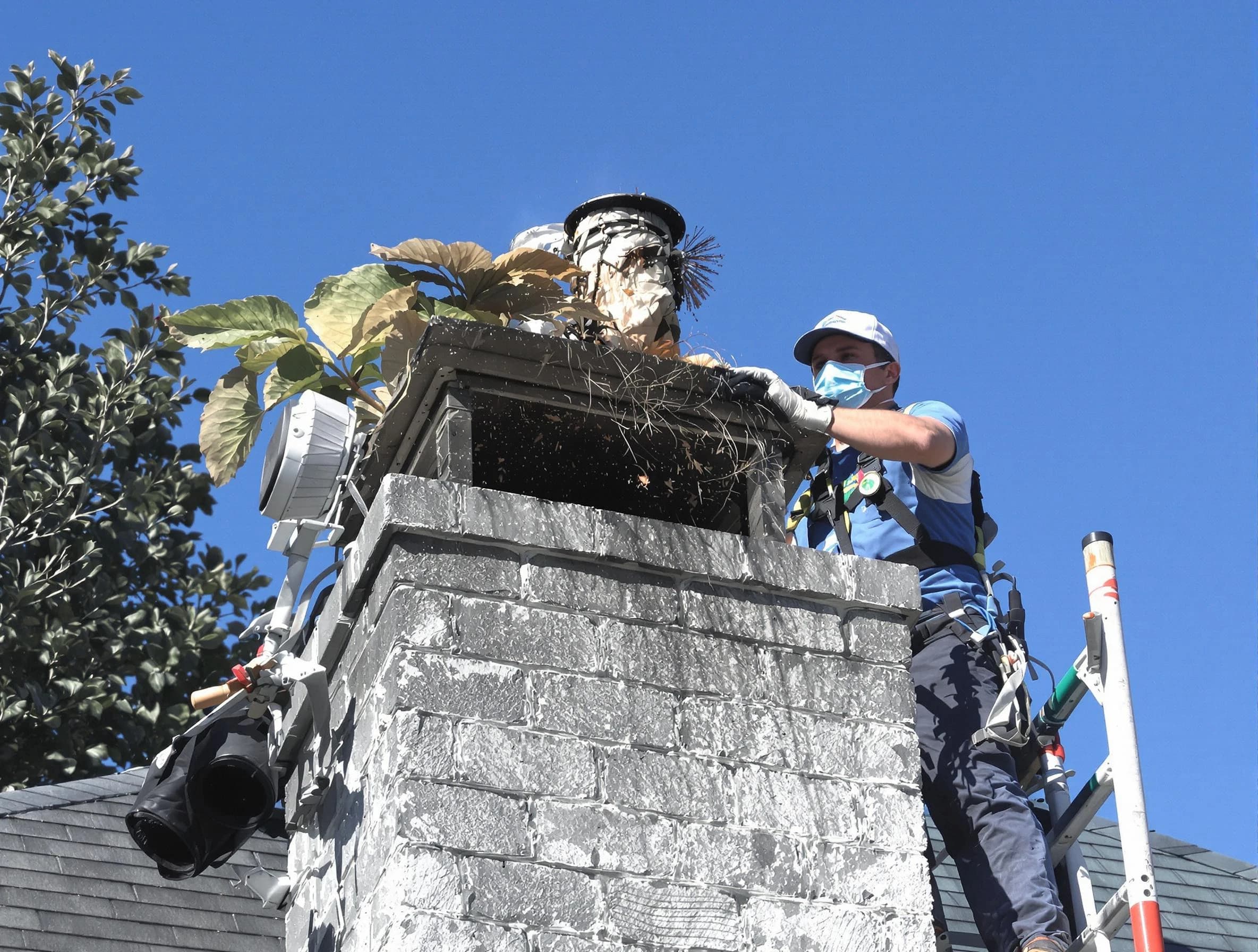 Lacey Chimney Sweep specialist performing chimney cleaning in Lacey, NJ